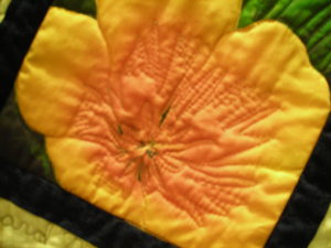 Close-up of a quilt made using our QuilTak quilt basting tools.